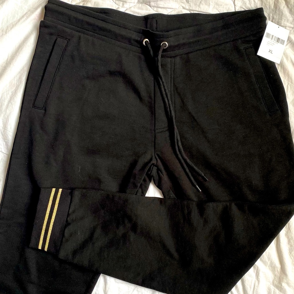Black joggers with gold trim